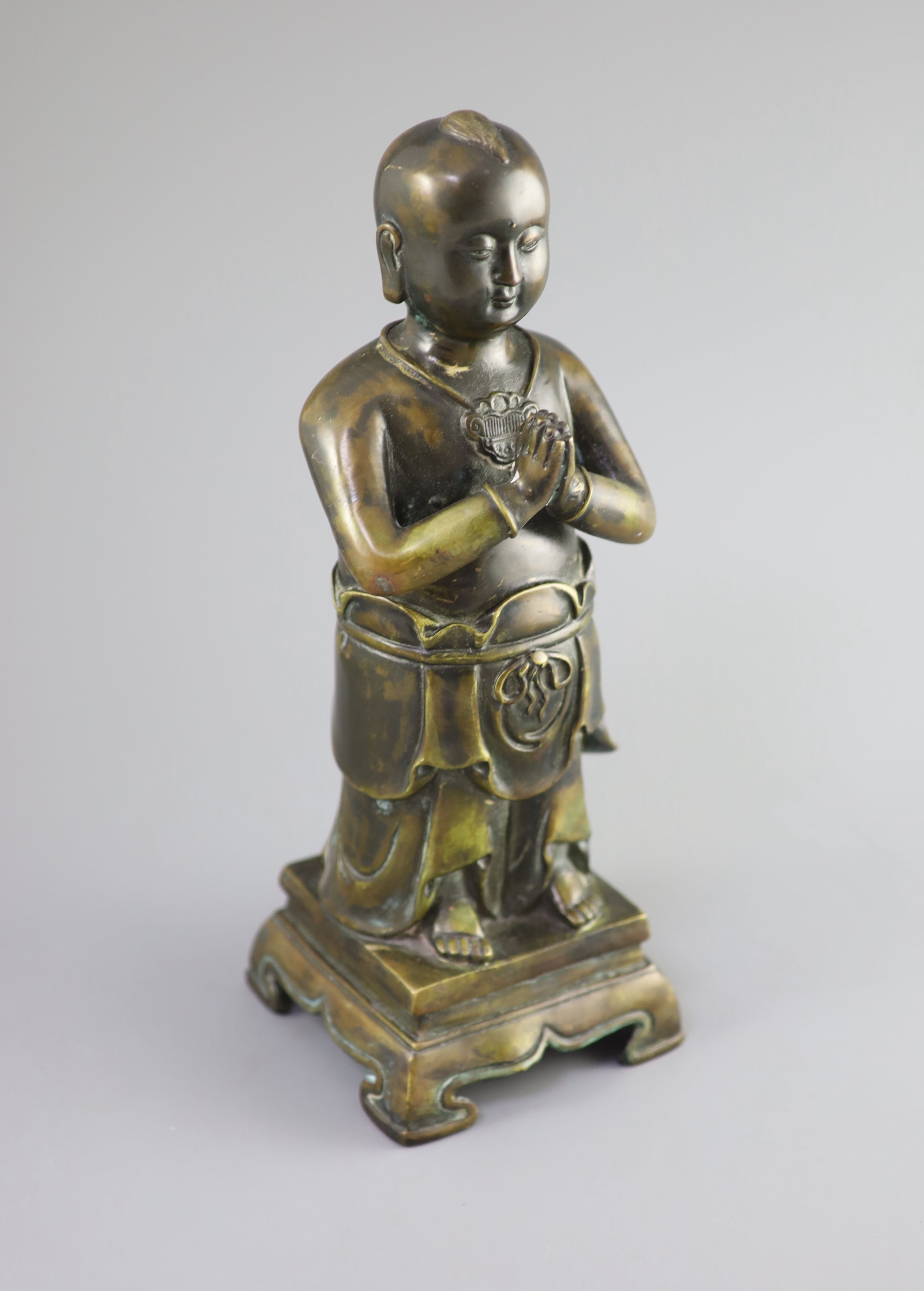 A Chinese bronze standing figure of Shancai Tongzi, 34cm high